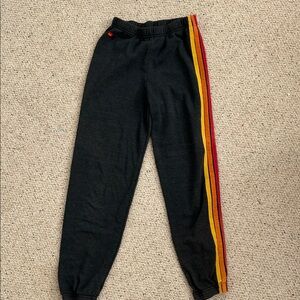Black Joggers with Red and Yellow Stripes